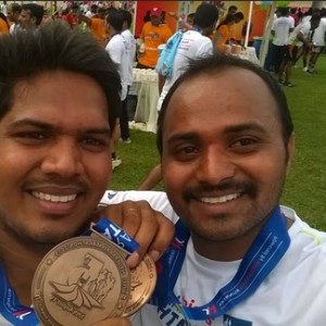 People displaying their medals